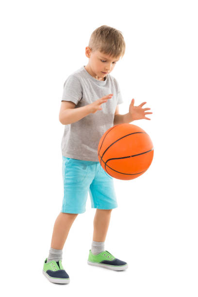 istock Cute Boy Playing Basketball 845916206