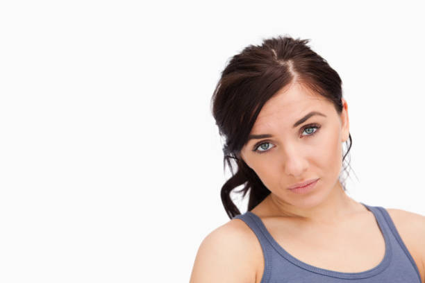 istock Unhappy young woman looking at camera 845922260