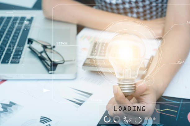 istock Business hand holding light bulb on document desk, concept of new technology ideas with innovation and creativity. 845924004