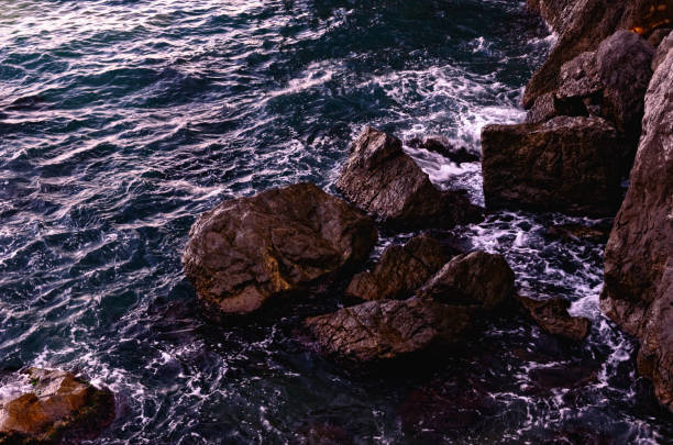 istock Breaking Sea Waves near Coastal Boulders 845926048