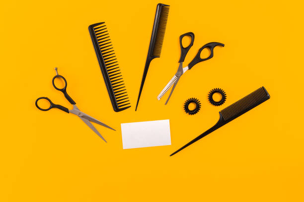 istock Hairdresser tools on yellow background with copy space, top view, flat lay 845926264