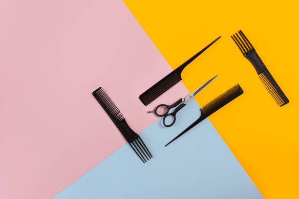 istock Barber set with combs and scissors on the color pink, yellow, blue paper background 845931328
