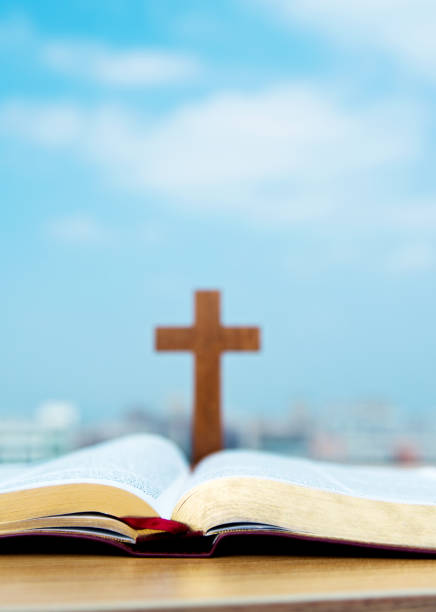 istock Bible and cross under the blue sky 845931440