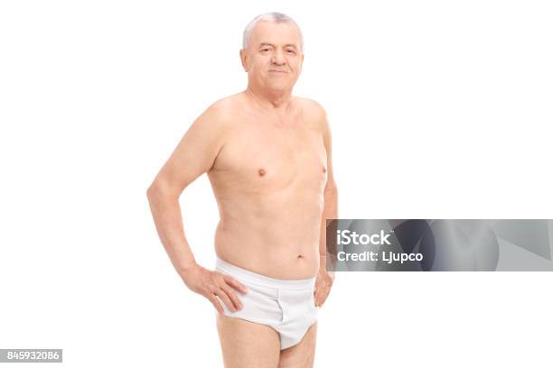 Mature Man In Underwear Looking At The Camera Stock Photo - Download Image Now - Naked, Shirtless, Underwear