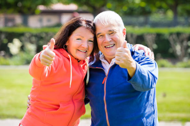 istock Senior Couple Showing Thumbs Up 845932214