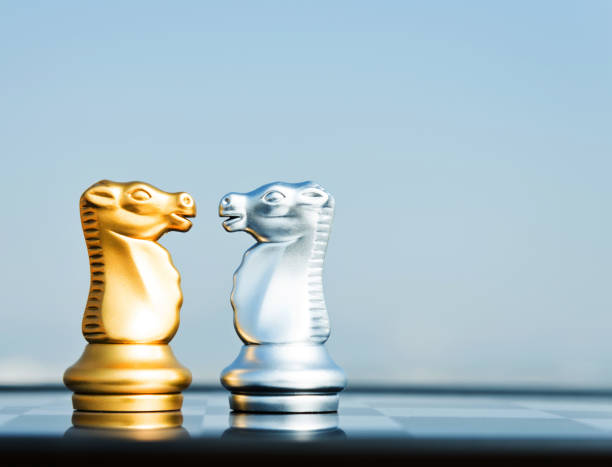 istock Silver knight and golden knight face to face 845933042