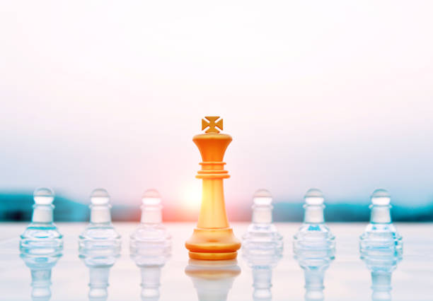 istock Golden king and transparent pawns 845935454