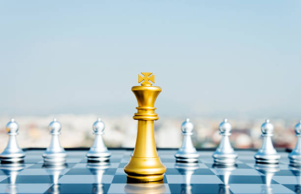 istock Golden king and eight pawns 845935460