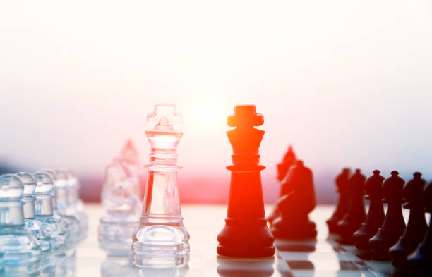 istock Transparent and black chess pieces on the board 845935618