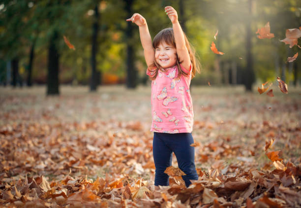 istock Little girl in autumn park 845935686