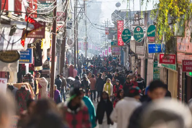 Crowd of people on the market street in winter in Darjeeling. India.