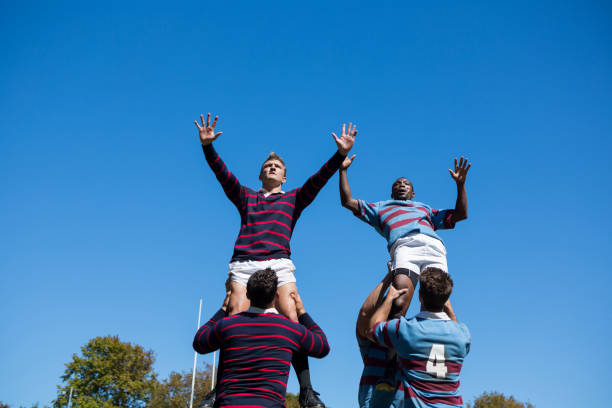 istock Low angle view of rugby players against clear sky 845936306
