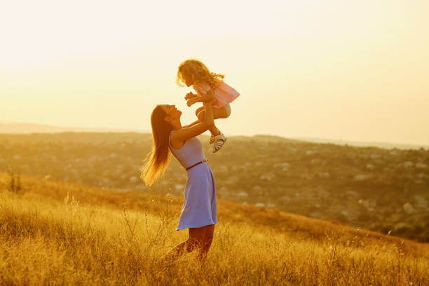 istock Mother and daughter in nature at sunset. 845943094