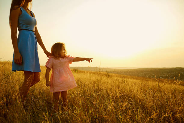 istock Mother and daughter in nature at sunset. 845943166