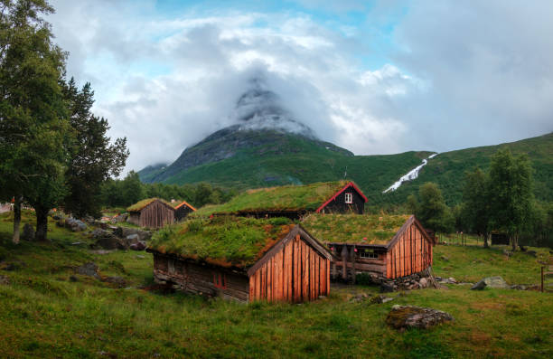 Typical norwegian old wooden houses with grass roofs in Innerdalen - Norway's most beautiful mountain valley, near Innerdalsvatna lake. Norway, Europe