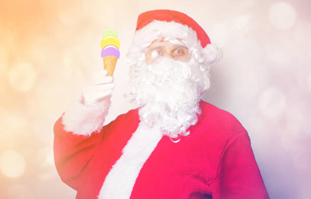 istock Funny Santa Claus have a fun with ice-cream 845946208