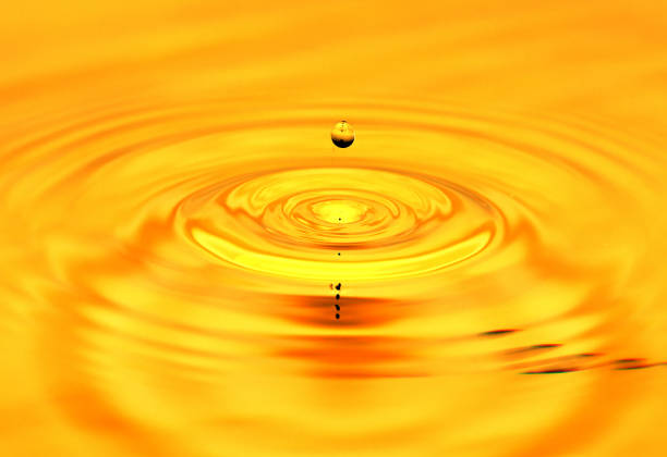 istock A drop of golden water. macro 845955654