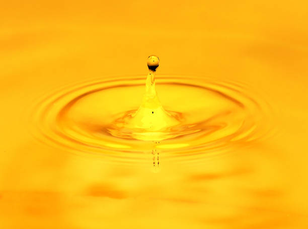 istock A drop of golden water. macro 845955698