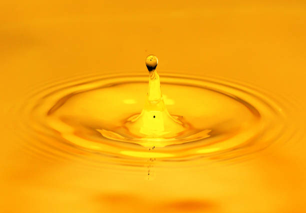 istock A drop of golden water. macro 845956044