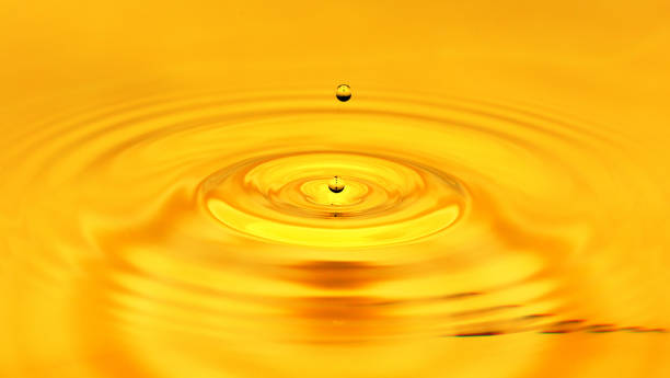 istock A drop of golden water. macro 845956108