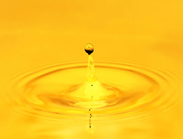 istock A drop of golden water. macro 845956190