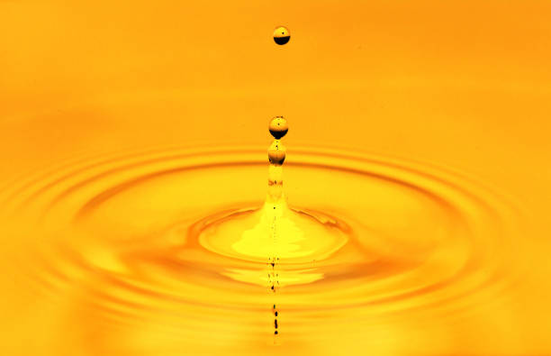 istock A drop of golden water. macro 845958344