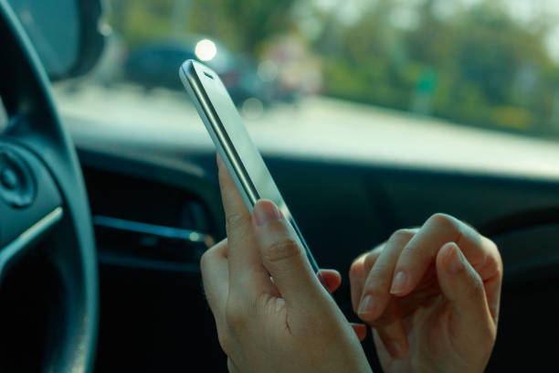 istock woman using smart phone on the car 845958634