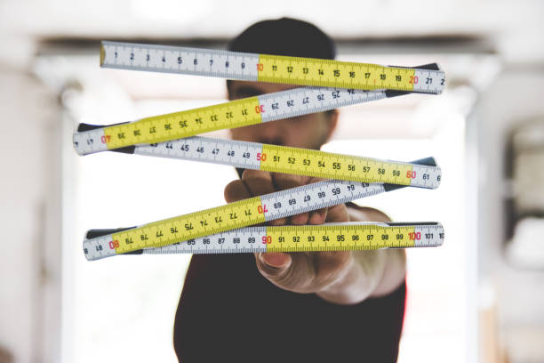 istock Young Adult Man Holding Wooden Meter 845959270