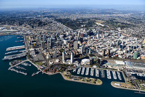 Helicopter point of view of San Diego, USA. USS Midway Museum and Embarcadero Marina Park are visible in the image.