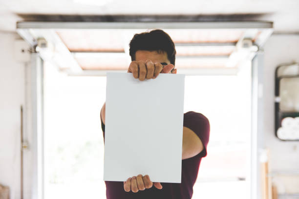 Young Adult Man Holding White Paper