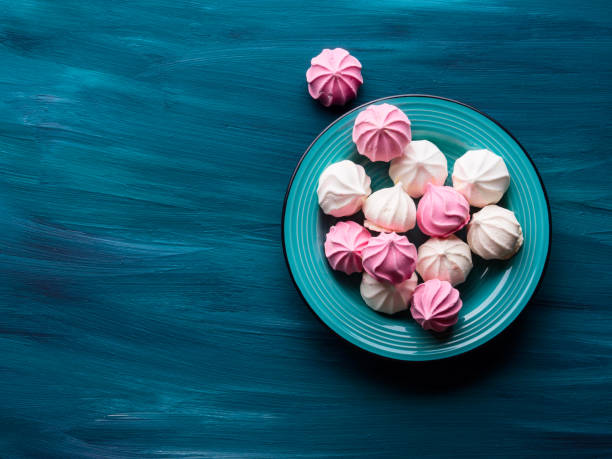 Pastel color meringue on green