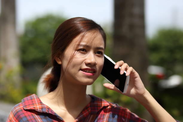 istock Young girl using smartphone in Vietnam 845967300