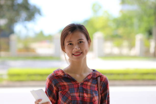 istock Young girl using smartphone in Vietnam 845969506