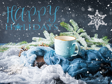 Mug of coffee and milk on dark blue winter background. Hot drink still life. Wishing happy holidays greeting card
