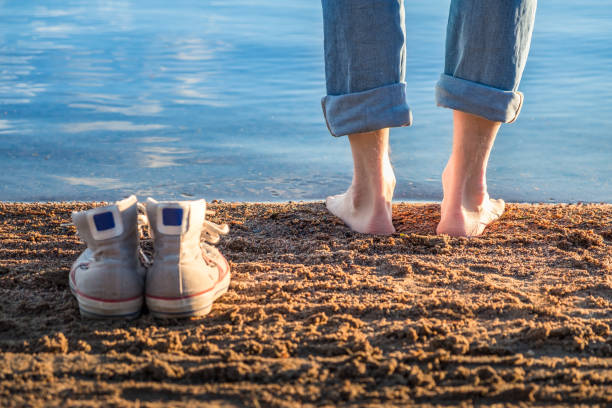 istock Man standing in beach at nice summer evening in Finland. 845977360