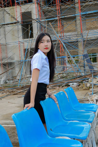 istock young student girl in uniform ,concept back to 845980142