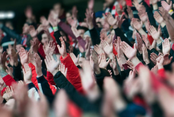 football fans clapping on the podium of the stadium - sport crowd fan stadium imagens e fotografias de stock