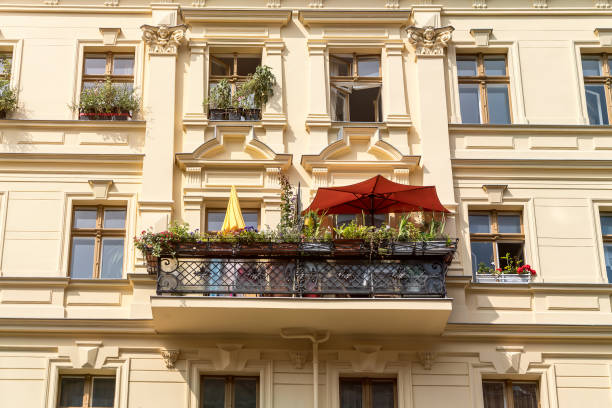 old Berlin apartment  with balcony and parasols in summer