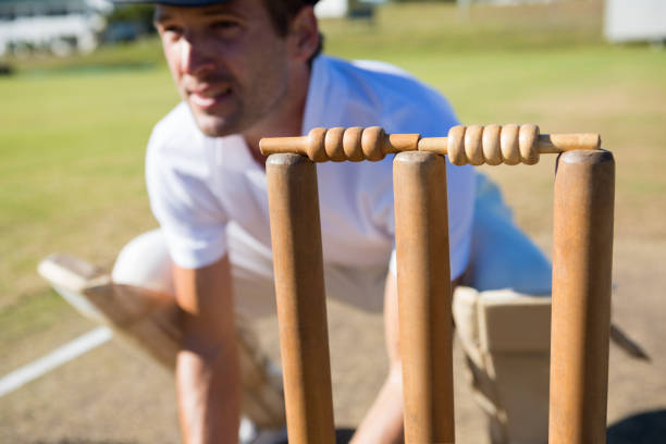 istock Close up of wicket keeper crouching by stumps 845984882