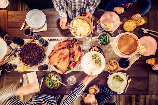 istock Family Having Traditional Holiday Stuffed Turkey Dinner 845985094