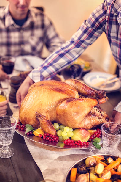 istock Family Having Traditional Holiday Stuffed Turkey Dinner 845985110