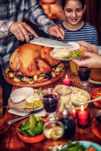 istock Family Having Traditional Holiday Stuffed Turkey Dinner 845985126