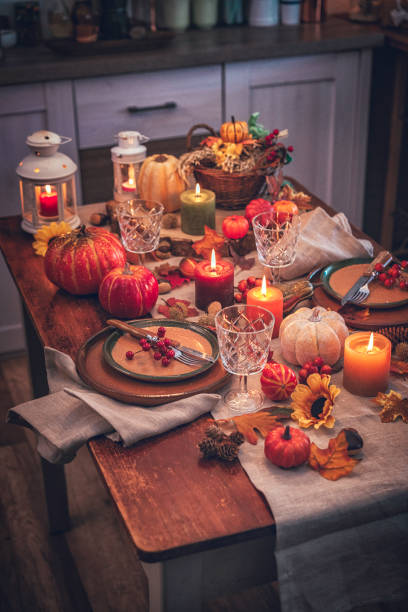 istock Decorated Table for Thanksgiving Dinner with Candles, Pumpkins, Leafs and Nuts 845985164