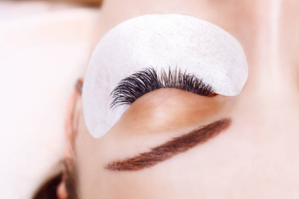 istock Eyelash Extension Procedure. Woman Eye with Long Eyelashes. Lashes, close up, macro, selective focus 845988168