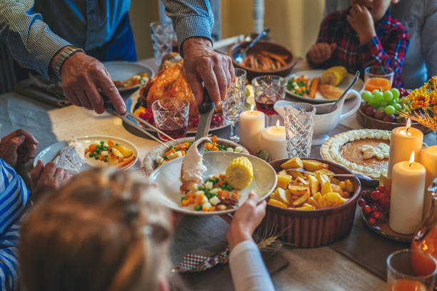 istock Family Having Traditional Holiday Stuffed Turkey Dinner 845988478
