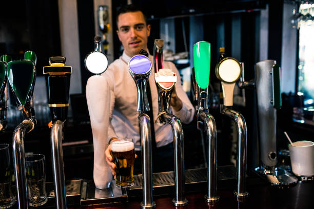 istock Barman serving a pint of beer 845989188