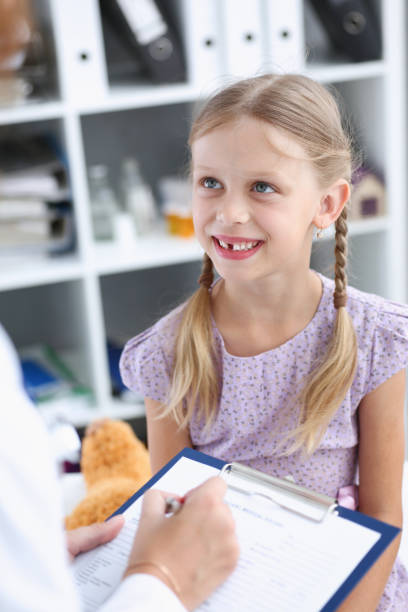 istock Little child with mother at pediatrician reception 845989252