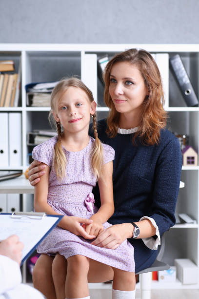 istock Little child with mother at pediatrician reception 845989468
