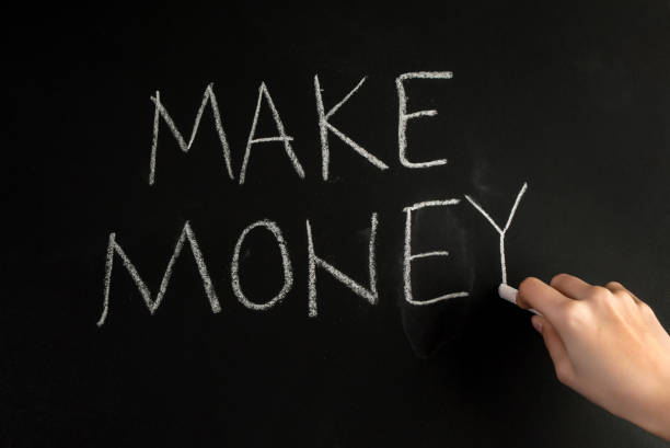 istock Girl hand write word Make Money with white chalk on blackboard 845991870