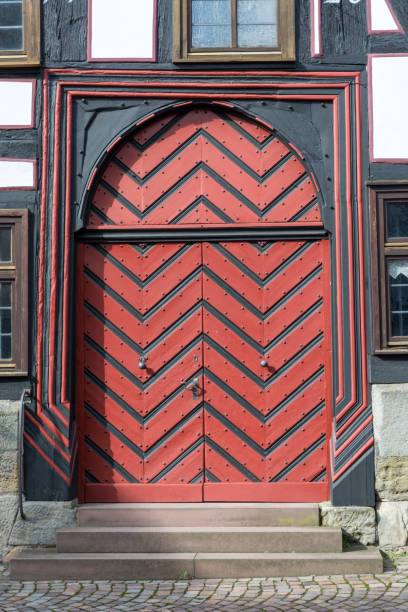 A red and black medieval wooden door from the front